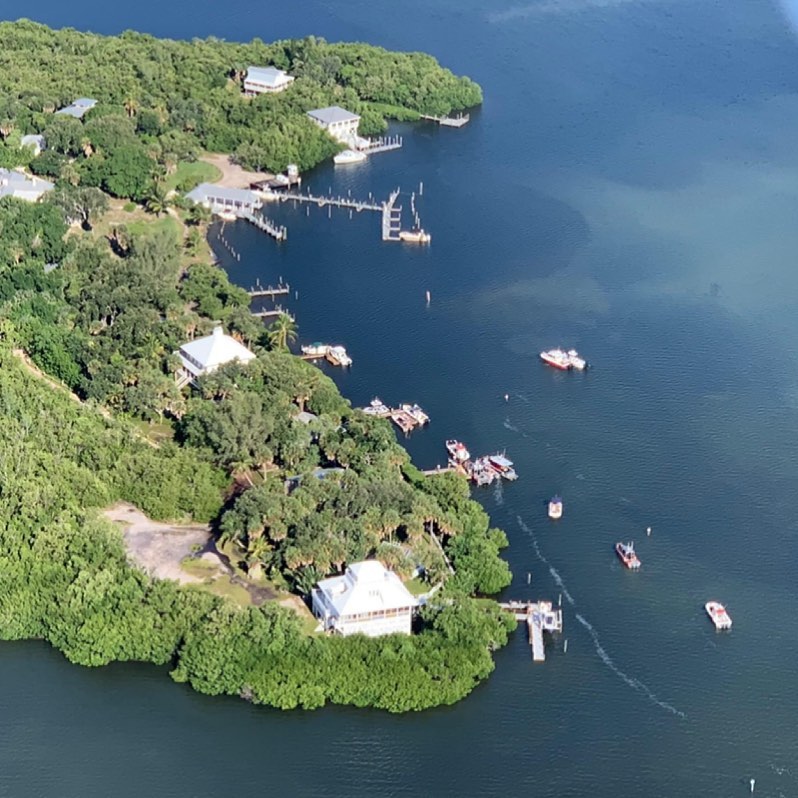 Breathtaking aerial view of Cabbage Key, a rustic island resort on the Southwest Florida coast.  A common backdrop in the “Pine Island Sound Mysteries” series.